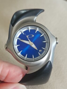 Oakley Blue Dial Silver-Tone Case Black Strap Watch